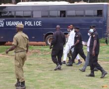 The suspect is being led away by the military police:<br />What is the matter with this African activist. He knows very well that this is an African dictatorship that does not accept freedom of expression and freedom of speech and human interaction. Political demonstrations are prohibited and one risks loosing ones life if one tries to do it even if this African country is an independent country. If this activist wanted to make a point he should have held a poster. If up to now he still has his life with him, he can continue making his case on social media.
