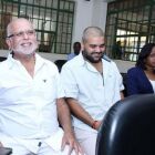 Sudhir Ruparelia (L) with his son Ranjiv in court as owners of Crane Bank.<br />Bank of Uganda should do a favor to the tax payers of this country and accept the work of the auditor general to do the accounts of this financial adventure. By keeping quiet about it all, it shows clearly how for example Bank of Uganda in the Commercial Bank saga, has been sabotaging the national economy since the Uganda Shilling was badly and politically devalued during 1987. Even up to date, there is mismanagement in the formulation of foreign exchange rates especially in terms of international money laundering.